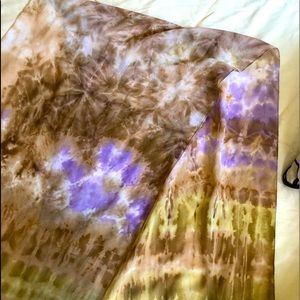 Scarf with bronze and purple print.
